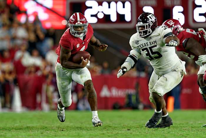 Oct 8, 2022; Tuscaloosa, Alabama, USA; Alabama Crimson Tide quarterback Jalen Milroe (4) carries the ball against Texas A&M Aggies during the second half at Bryant-Denny Stadium.